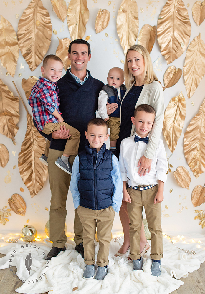 Family of 6 with all boys dressed in blue for Fall holiday family portrait session in fun Joyful Gatherings gold set design