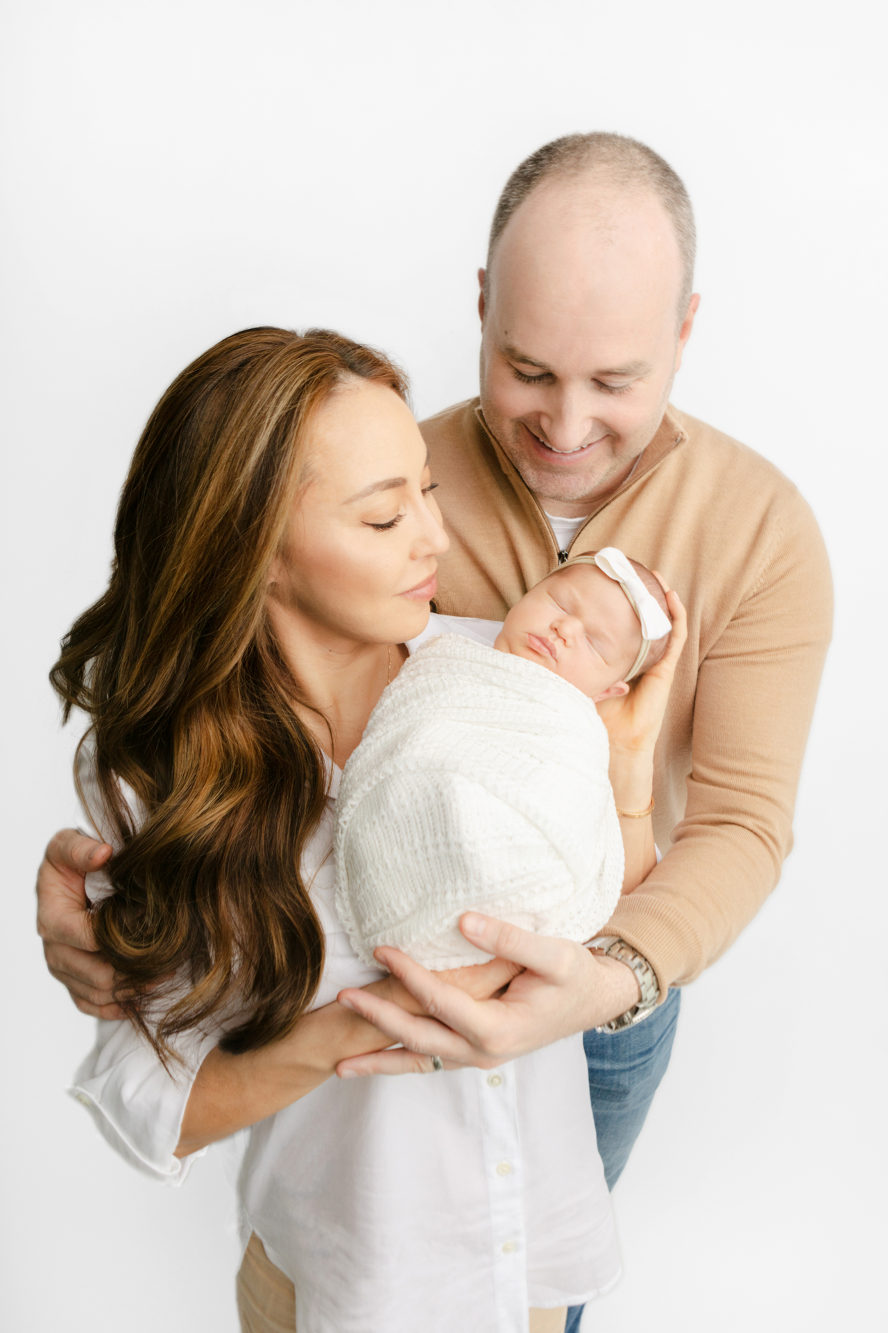new family of three: mom, dad, and new baby girl named Emelia; neutral family newborn photography