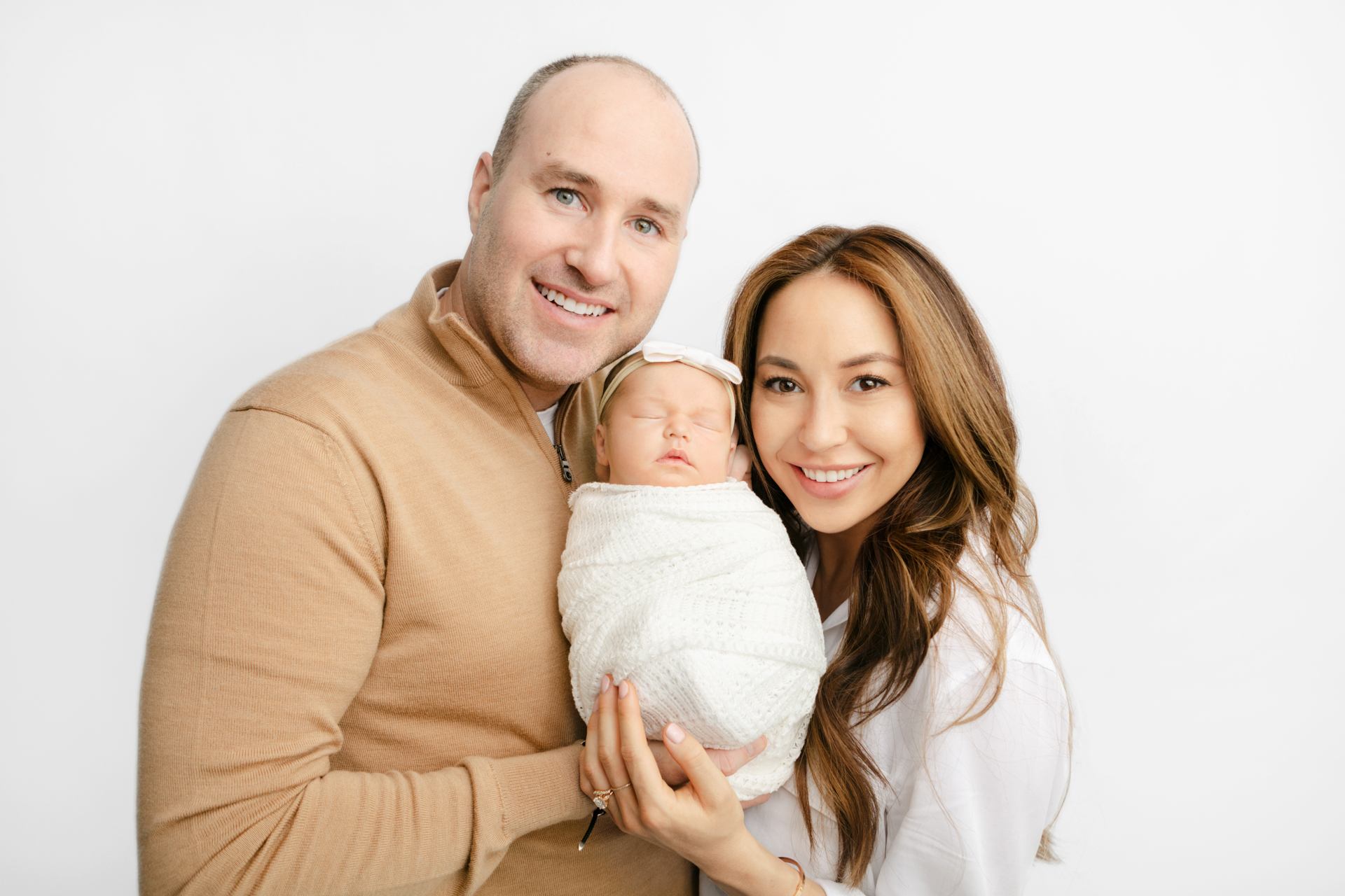 new family of 3 photographed in studio by Karen Kahn of Looking Up Photography