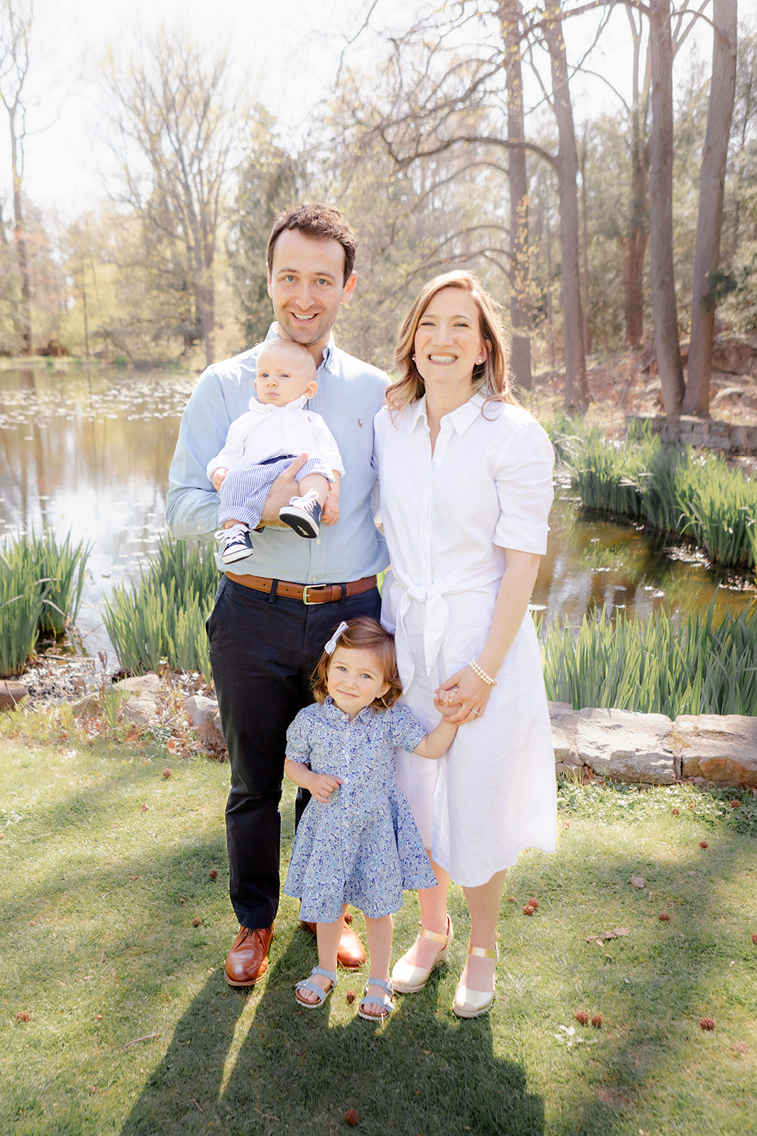 family of four dressed in classic New England style outfits, photographed in the spring in Connecticut; family Easter outfits