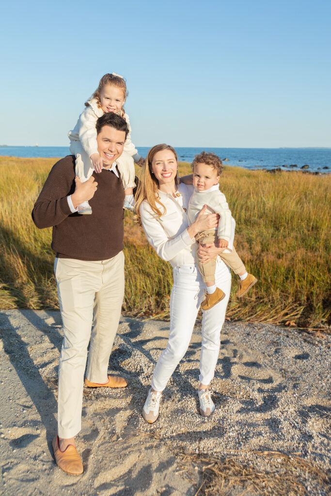 A Connecticut family of four are photographed during the Golden Hour along the Connecticut seaside. The family look straight out of a Ralph Lauren ad!