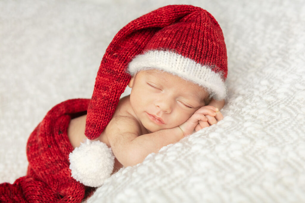 Christmas themed newborn portrait photographed by Karen Kahn, of Looking Up Photography, Greenwich, Connecticut