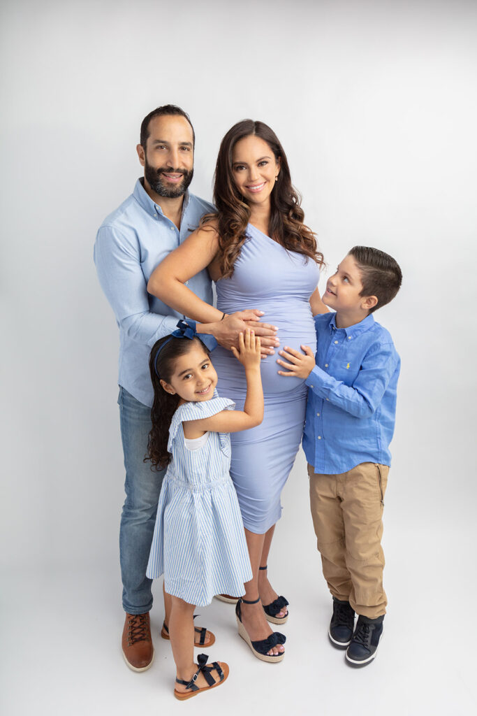 A soon-to-be family of five are photographed at the Looking Up Photography studio in Greenwich, Connecticut, by Karen Kahn