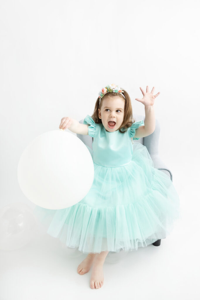 a 3 year-old little girl named Blake is photographed at the Looking Up Photography studio in Cos Cob, Greenwich, Connecticut, for her 3rd birthday 